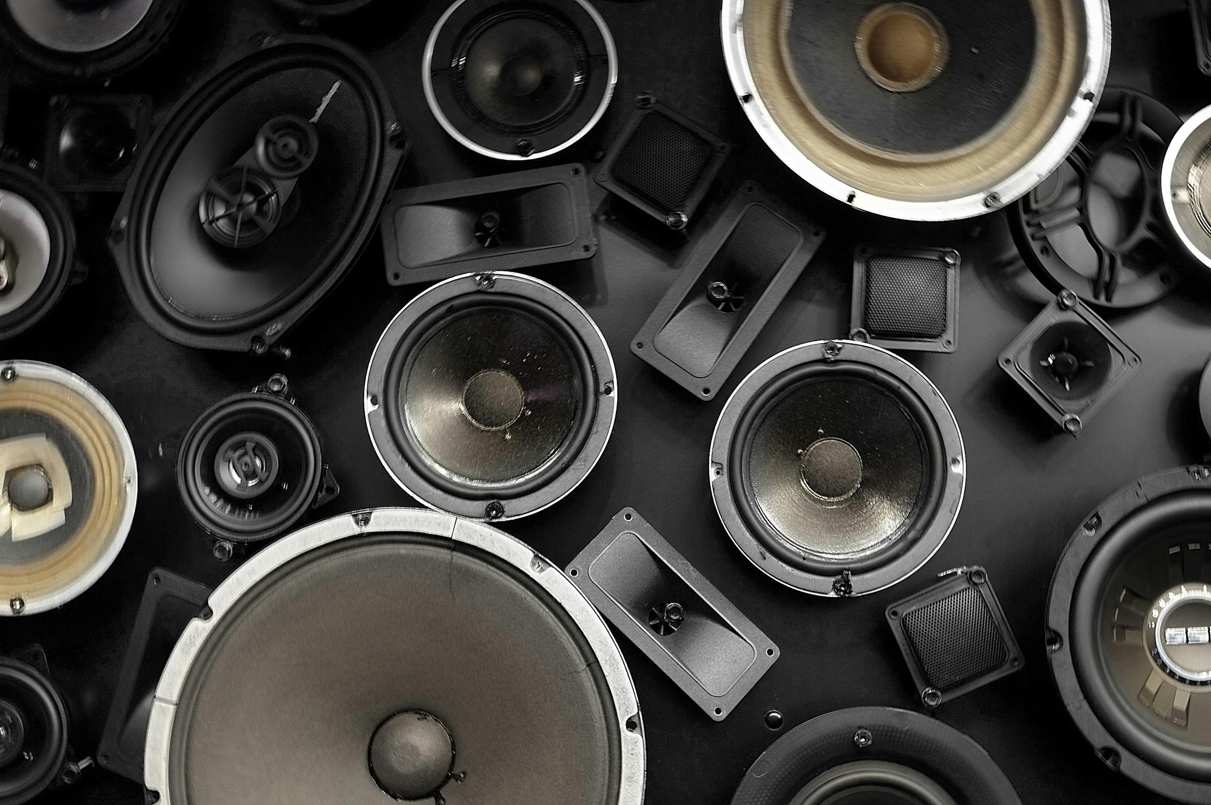 Multiple insides of speakers on a dark grey background