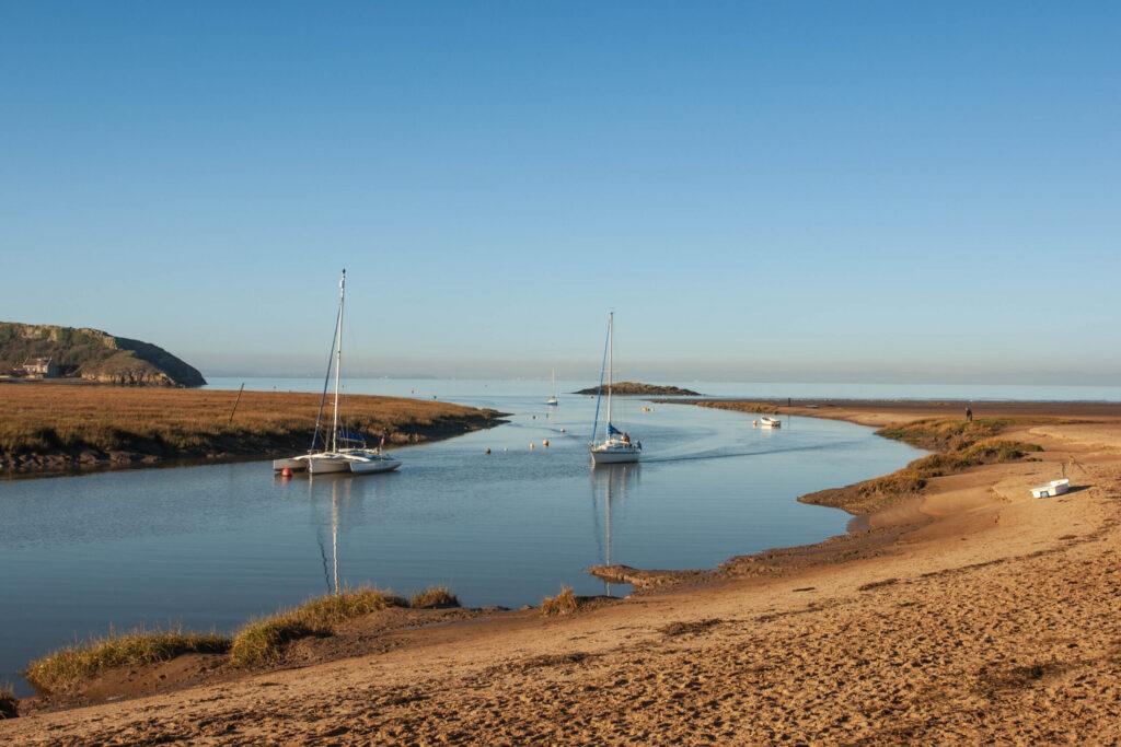 Two boats on the estuary at Uphill Beach, Weston-super-Mare