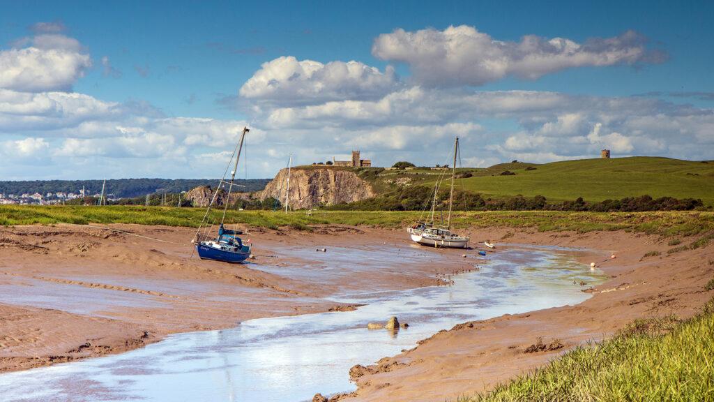 Boats waiting for the tide to come in on the River Axe at Uphill