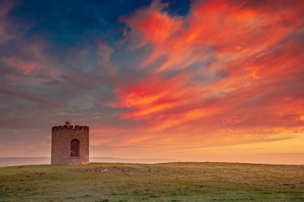 Dramatic red and orange sunrise over Uphill Beacon