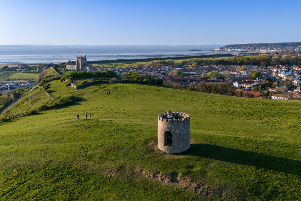 Aerial view over Uphill Beacon and church looking towards Weston-super-Mare