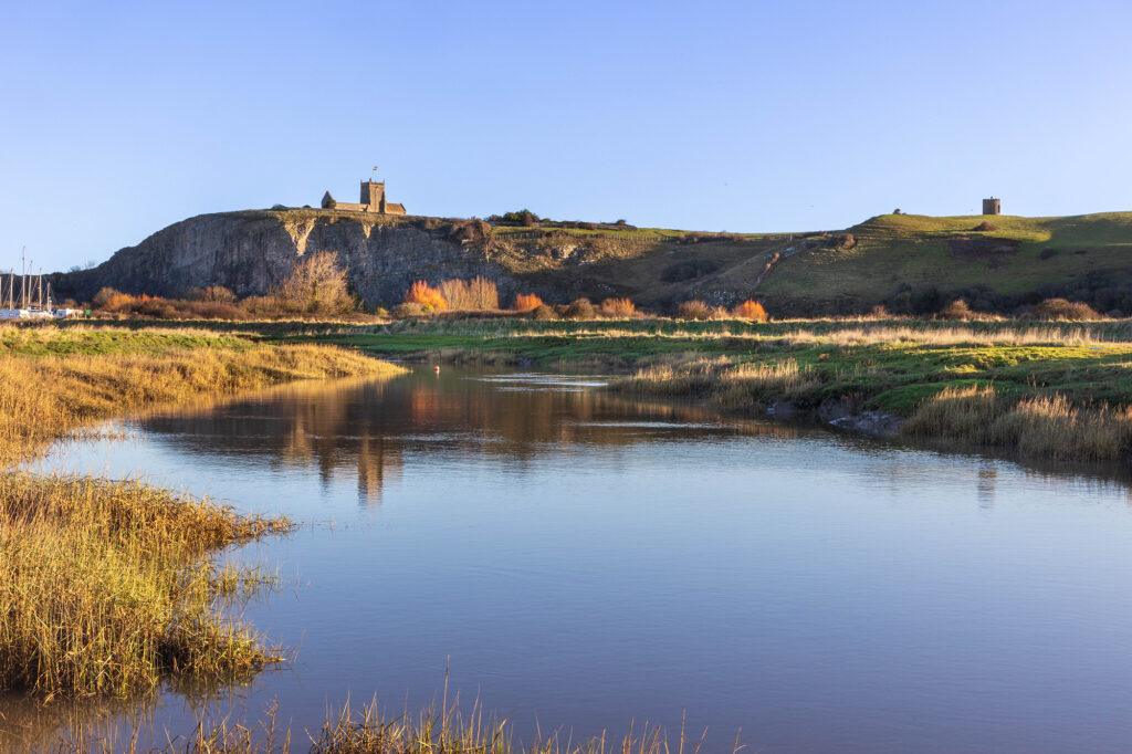 Looking from the Uphill nature reserve across the river to Uphill church and cliffs