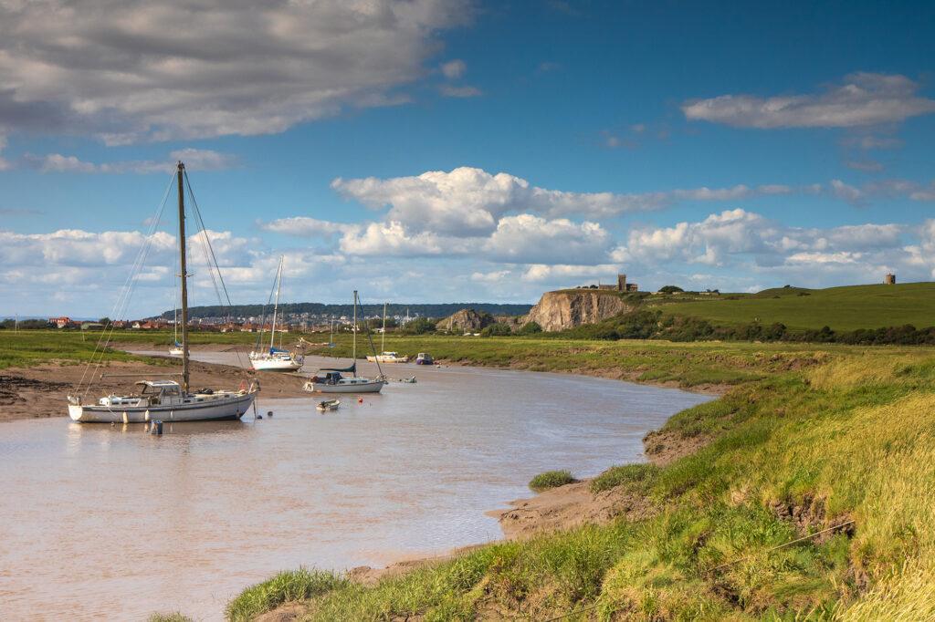 View from the Axe estuary looking north towards the cliffs at Uphill