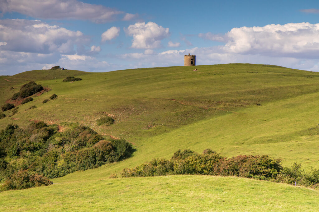 Green fields leading up the hill to the Uphill Beacon