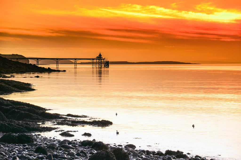 Clevedon Pier at sunset as scene from Ladye Bay along the coast path