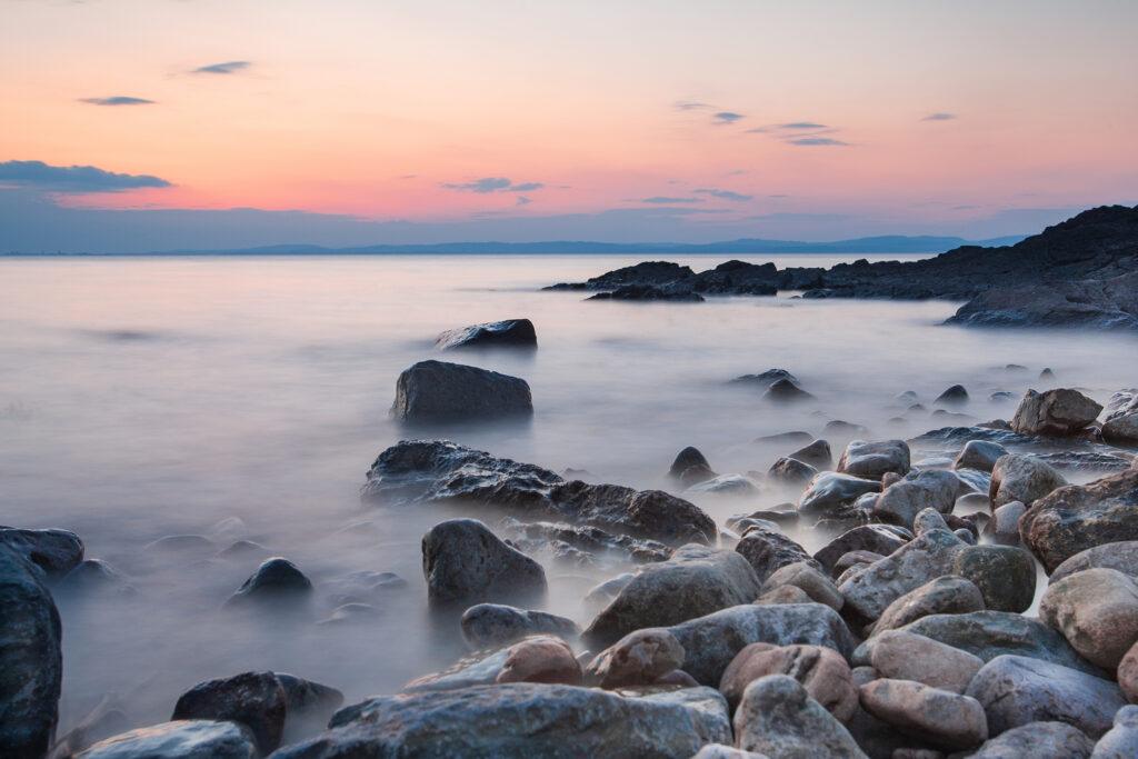 Rocks on Clevedon beach at sunset