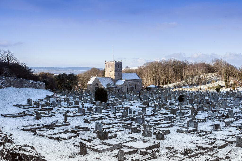 Snowy churchyard scene on Poet's Walk, Clevedon, Somerset