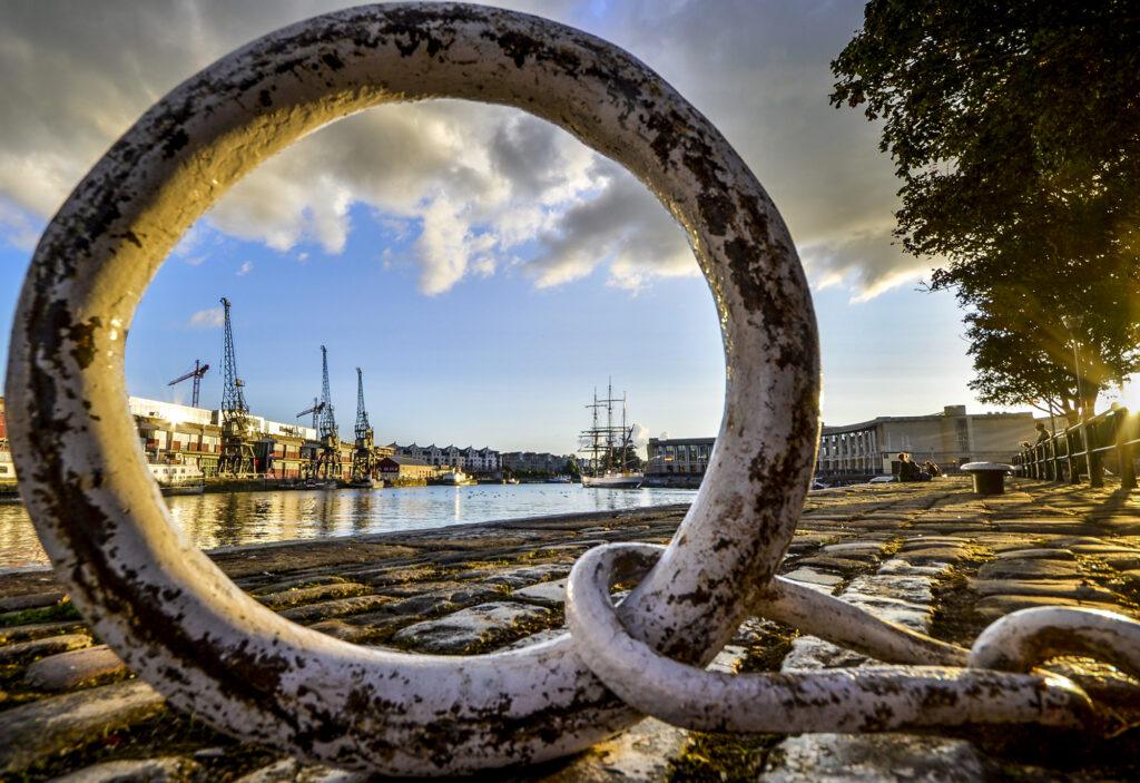 Looking through a metal hoop to moor boats at Bristol docks