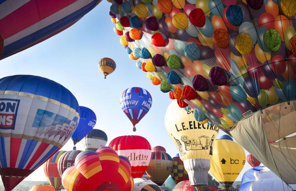 Dozens of colourful hot air balloons about to be set off at the Bristol Balloon Festival