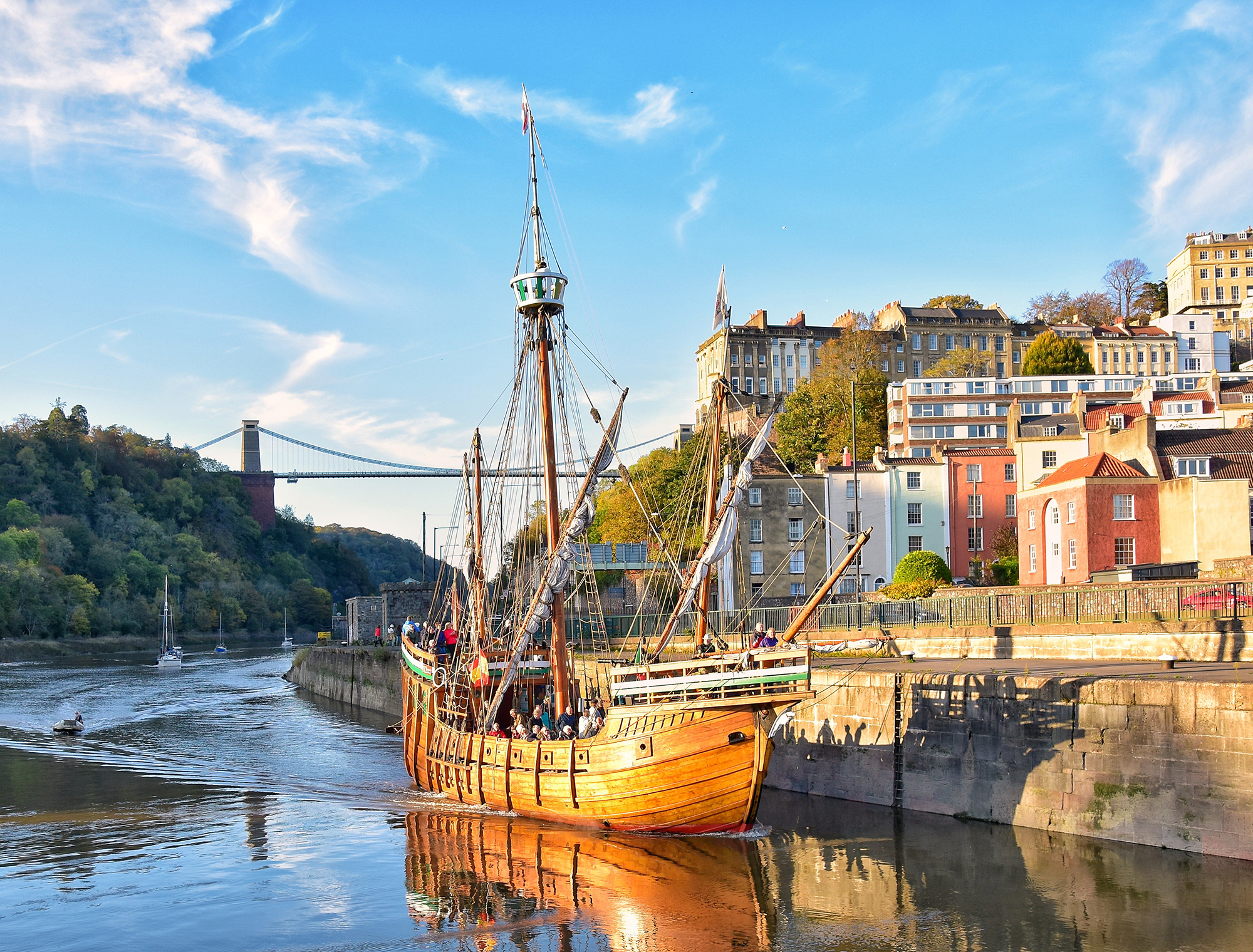 The historic Matthew ship in Bristol's Cumberland Basic with the Clifton Suspension Bridge behind