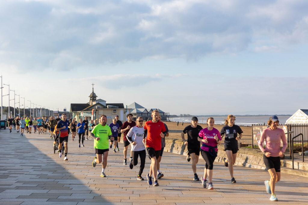 Lots of runners on the promenade in Weston-super-Mare taking place in the weekly Parkrun
