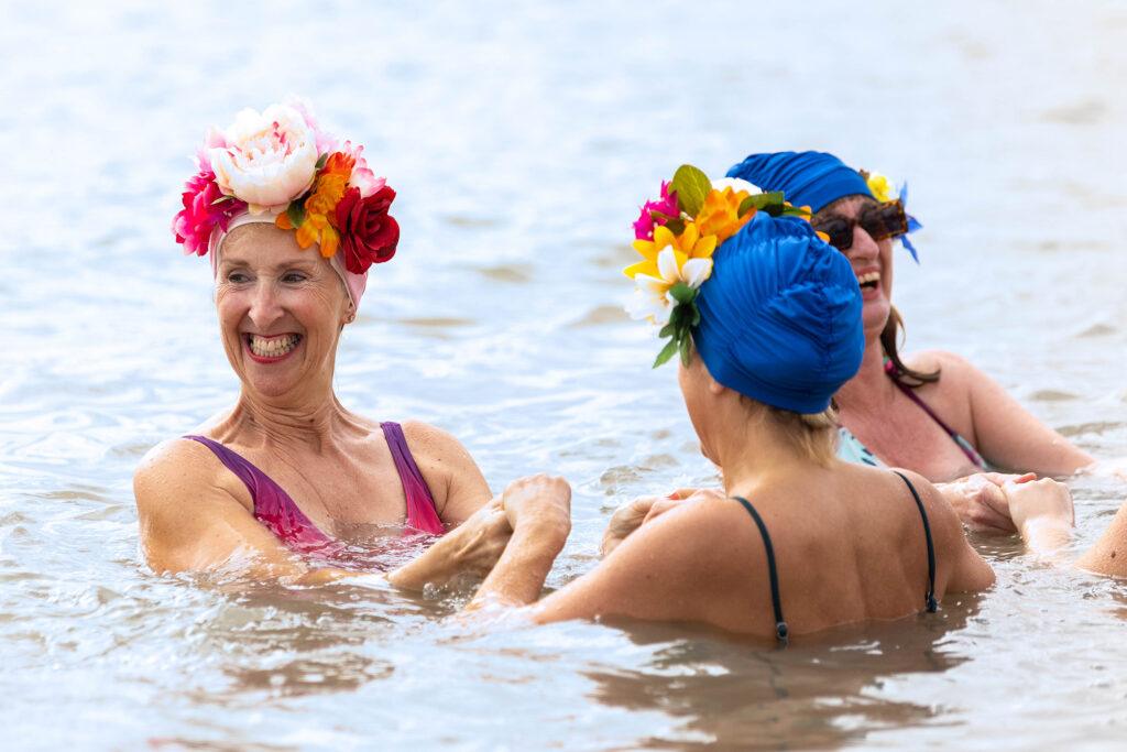 Three ladies in swimming hats in Weston's Marine Lake