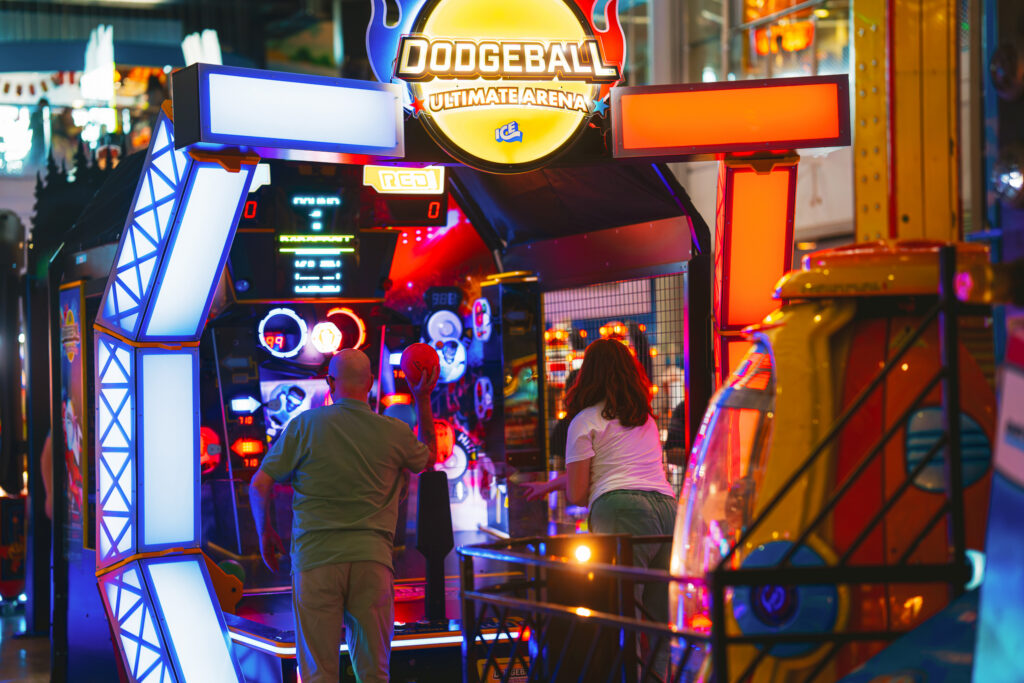Two people playing the arcade game Dodge Ball on the Grand Pier, Weston-super-Mare