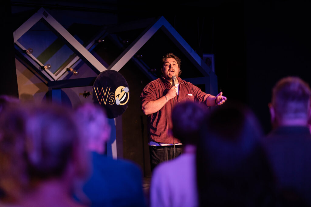 A comedian on stage at the Front Room fringe theatre, Weston-super-Mare