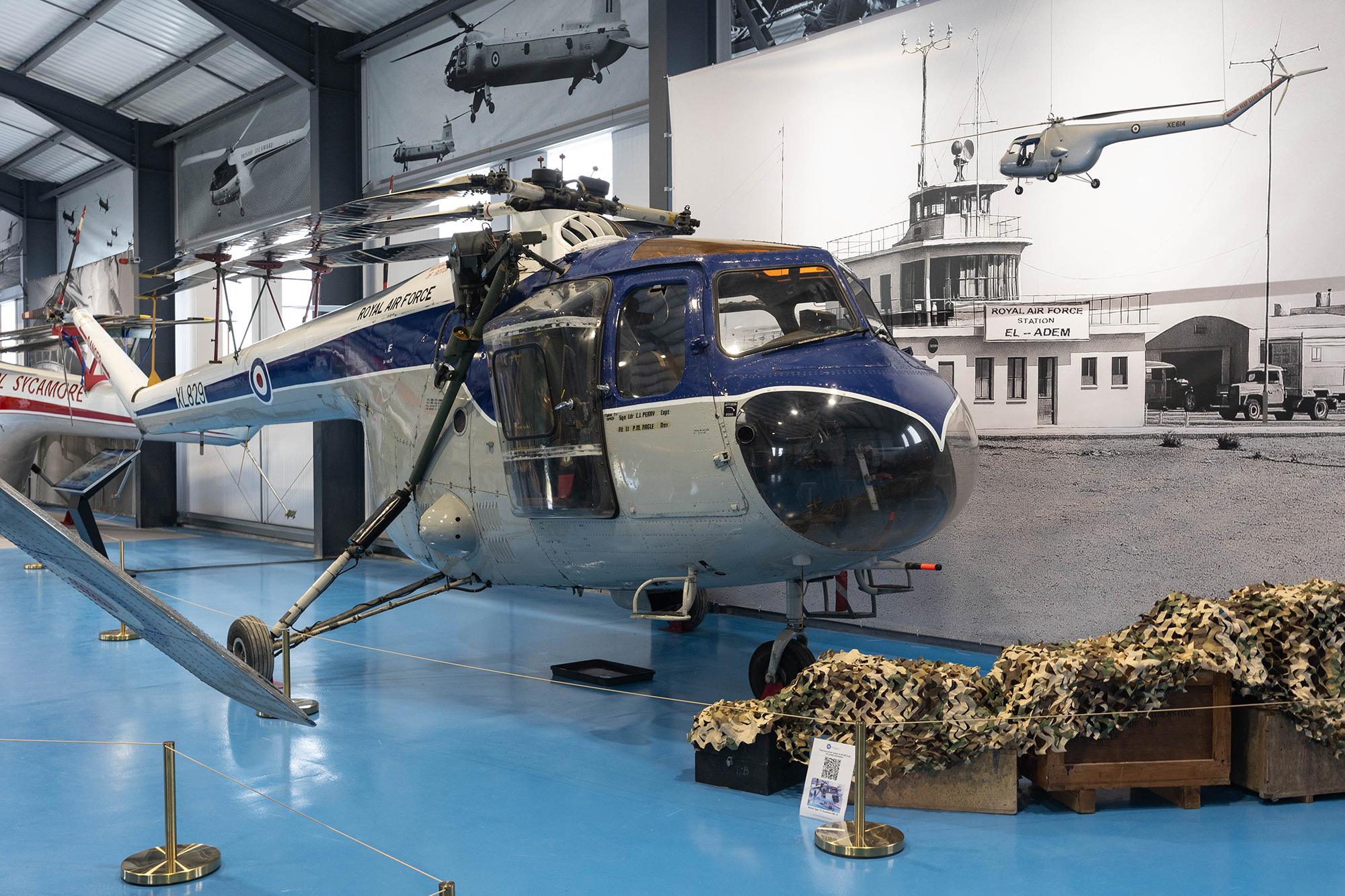 A blue and grey helicopter in the new hangar of the Weston-super-Mare Helicopter Museum