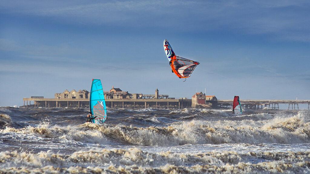 A windsurfer becomes airborne in rough seas at Weston-super-Mare