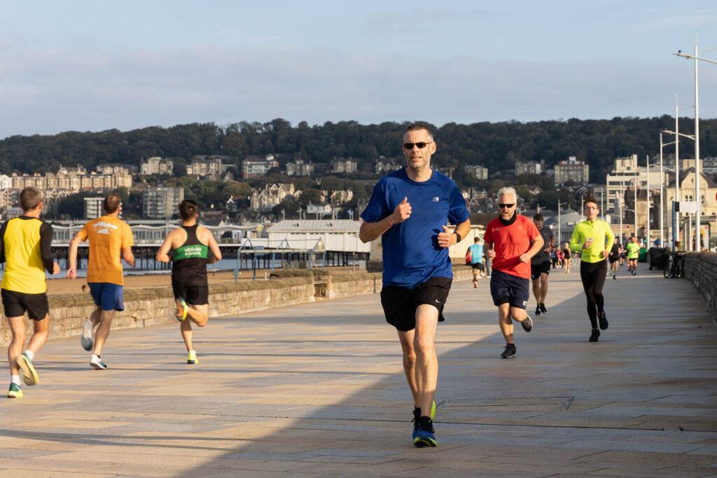 A steady stream of runners on Weston-super-Mare promenade for the weekly Marine Parade parkrun