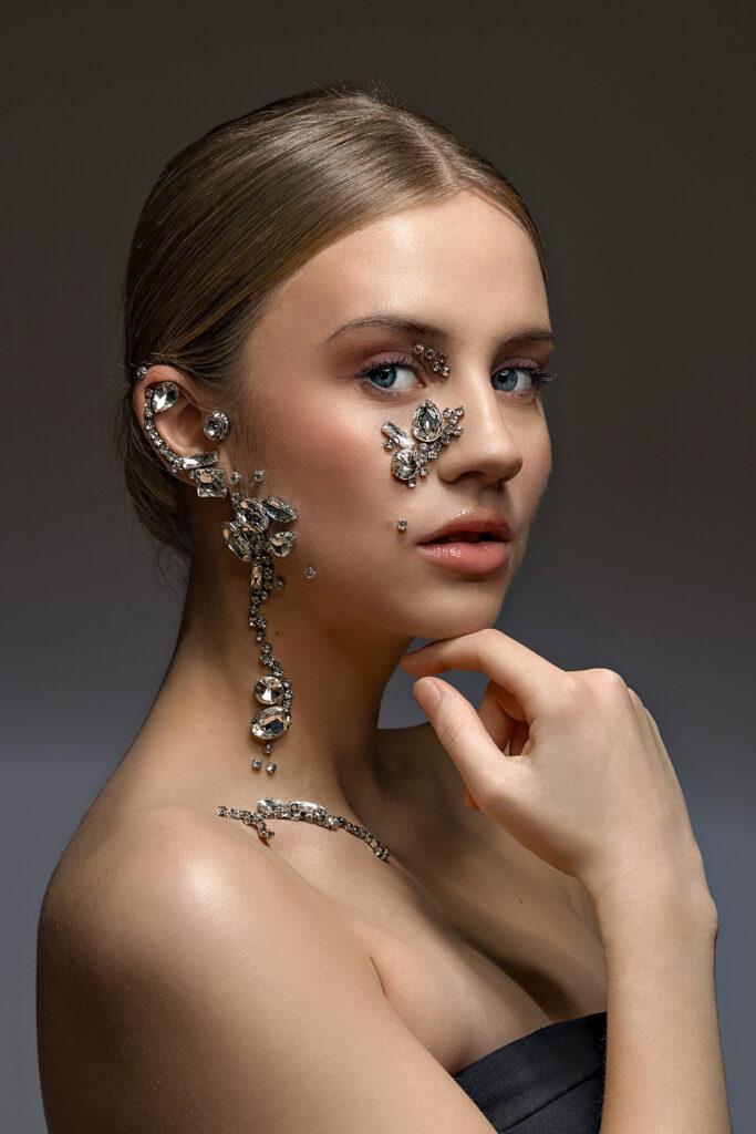 Mugshot of a woman with metal jewellery on her skin