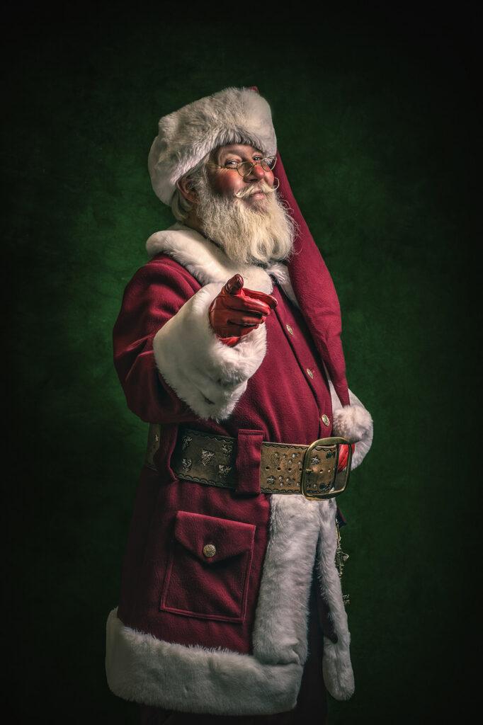 Santa Claus pointing at the camera