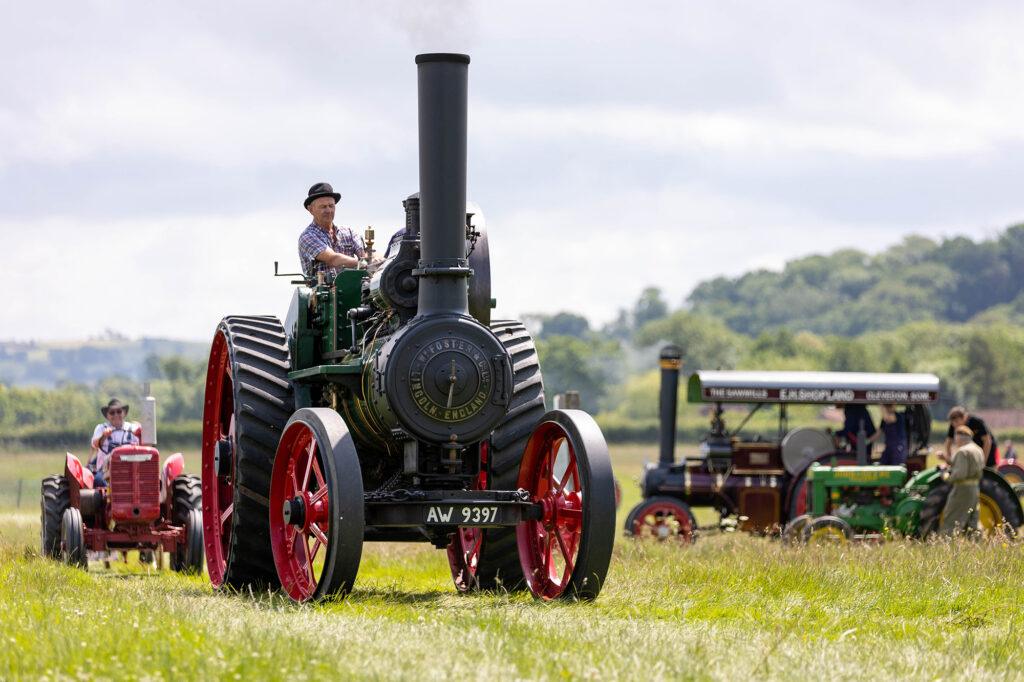 A traction engine leads of parade of farming vehicles at the Dig for Victory Show in North Somerset