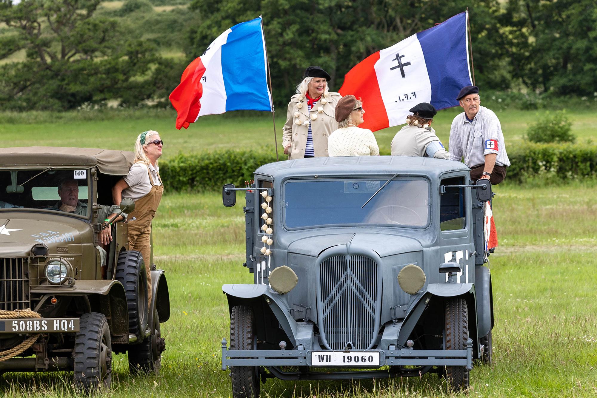 A French Military vehicle with flags and 'members of the resistance' at the Dig for Victory Show in North Somerset