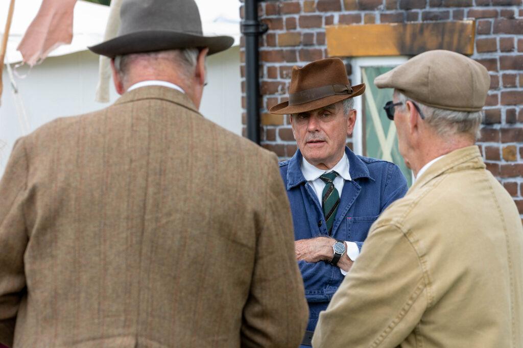 Three men in 1940s costume chatting at the Dig for Victory Show in North Somerset
