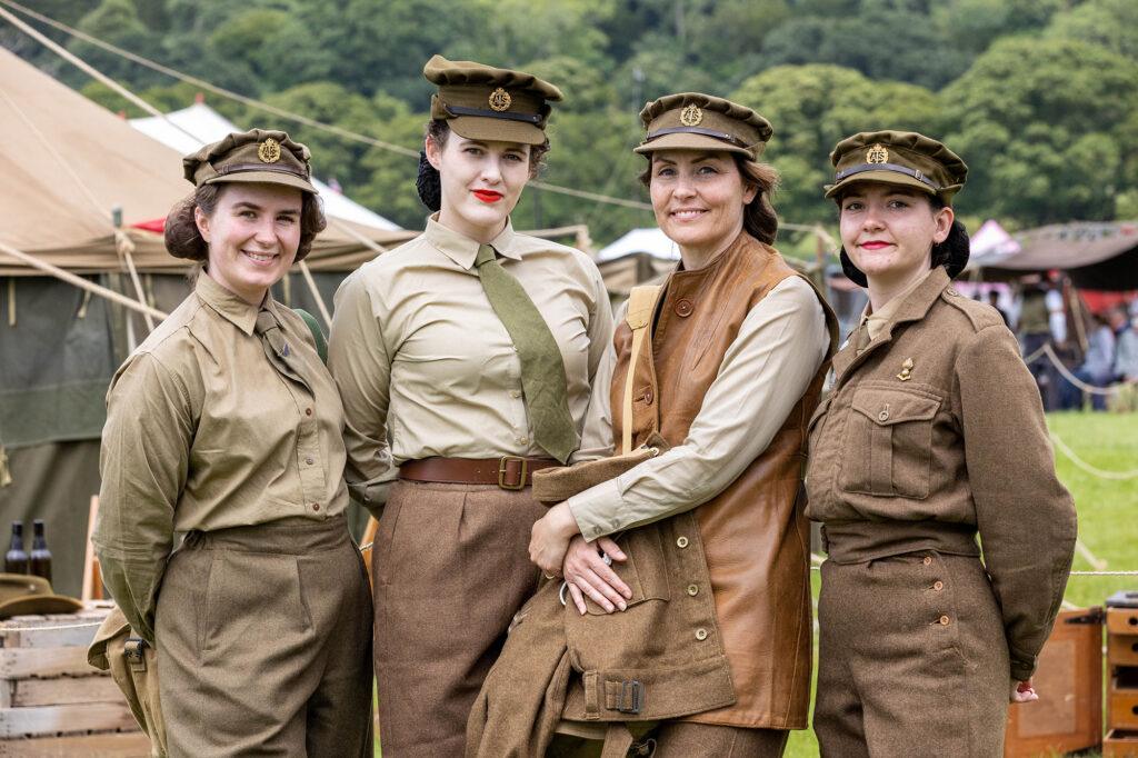 Four women in 1940s military costume at the Dig for Victory Show in North Somerset