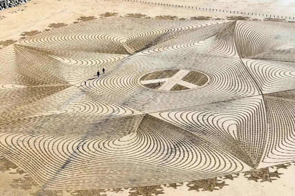 Elaborate and huge sand art design on Brean Beach, North Somerset