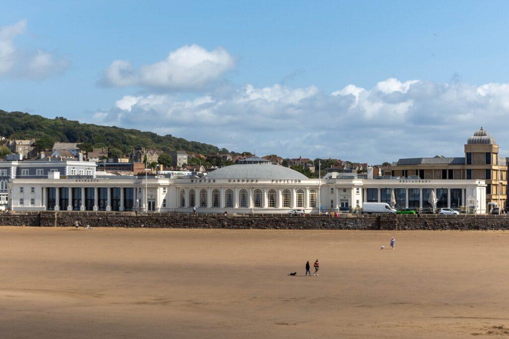 Looking inland across the sandy beach at Weston-super-Mare to the Winter Gardens Pavilion
