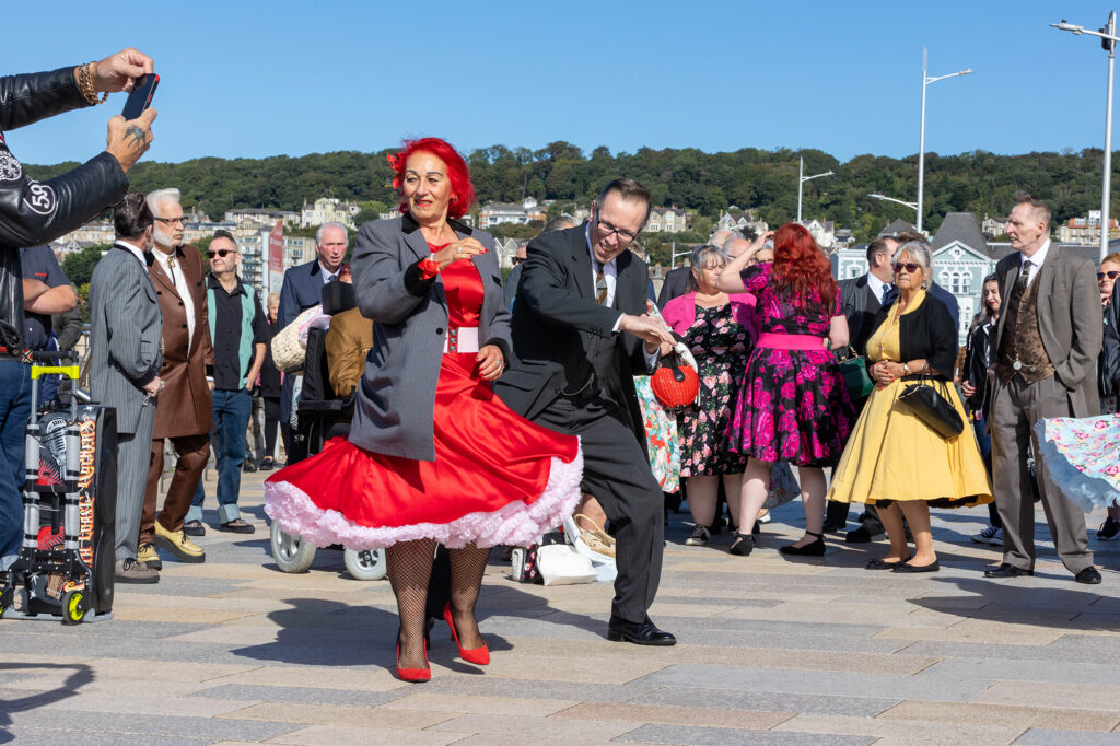 A man and a woman dancing on the Weston-super-Mare promenade at the annual Teddy Boy Tempest festival