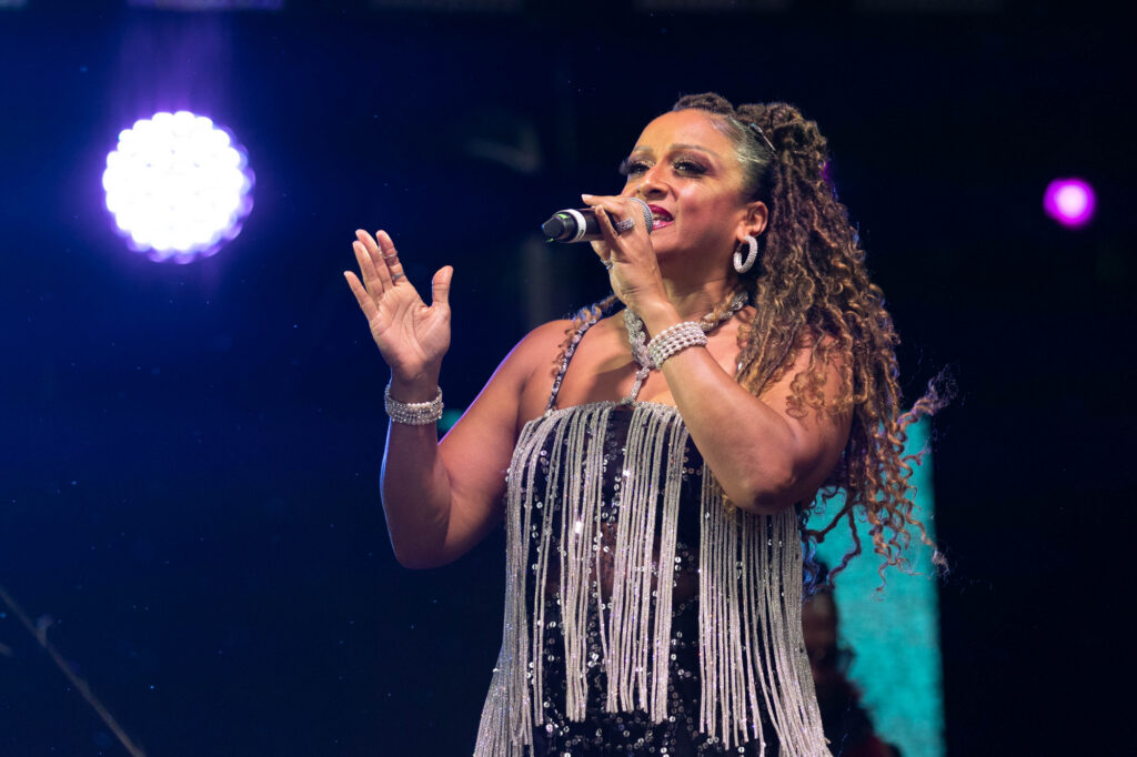 Close up of female singer performing into her microphone
