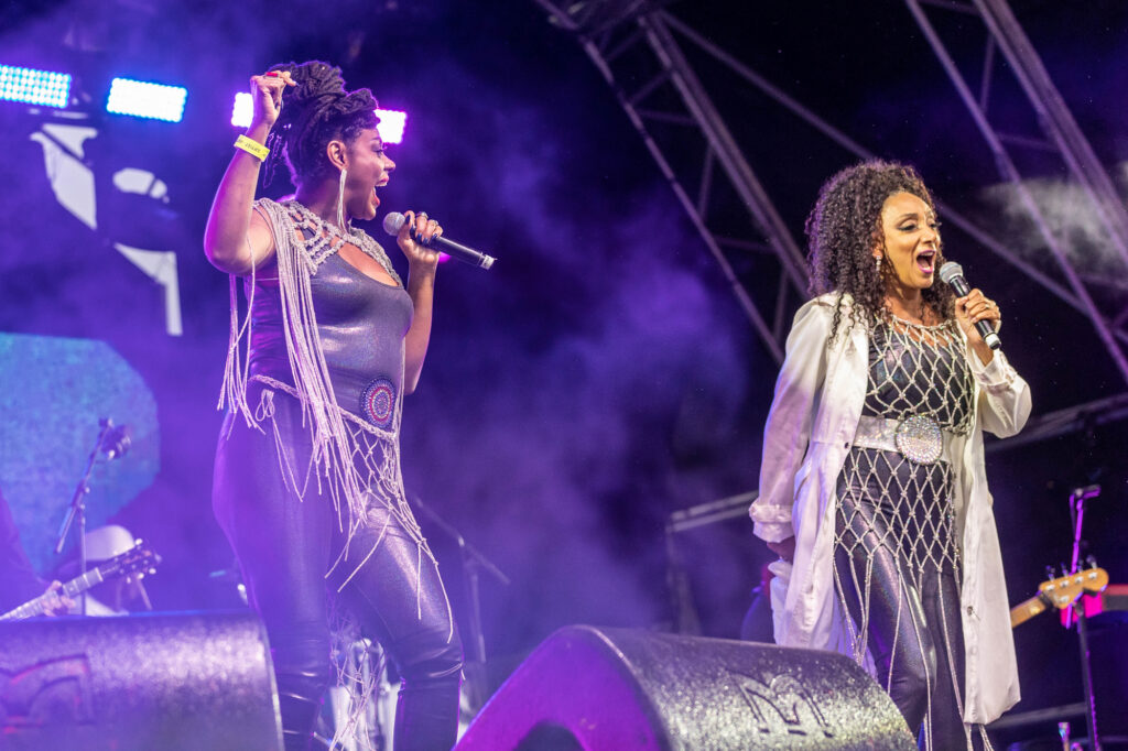 Two members of a girl band on stage