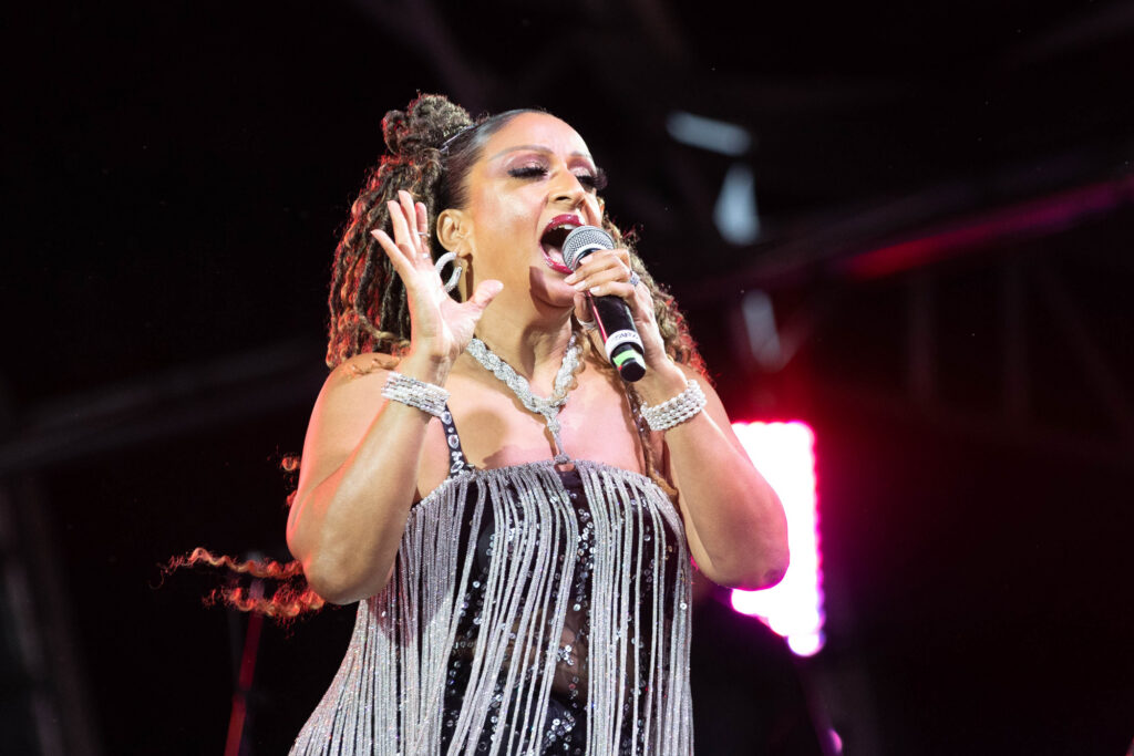 Close up of a female singer singing into a microphone