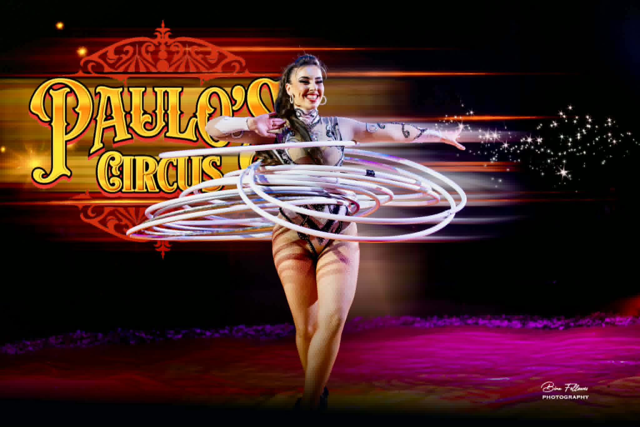 A woman hula hoops several of them