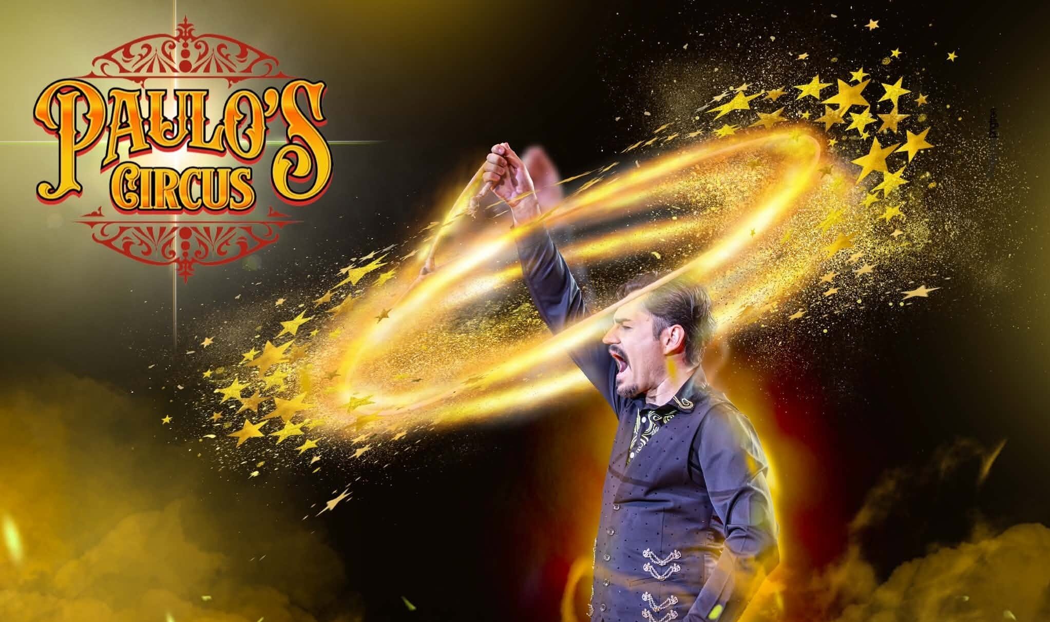 A man holds his arm up and a circle of light surrounds it