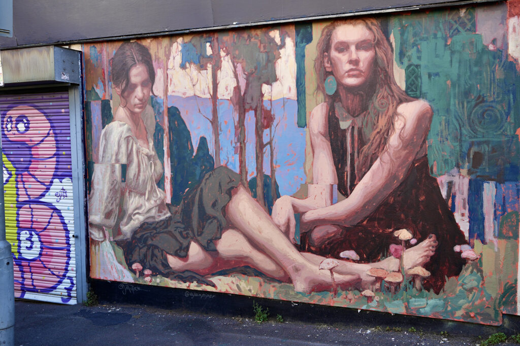 Street art mural of two women