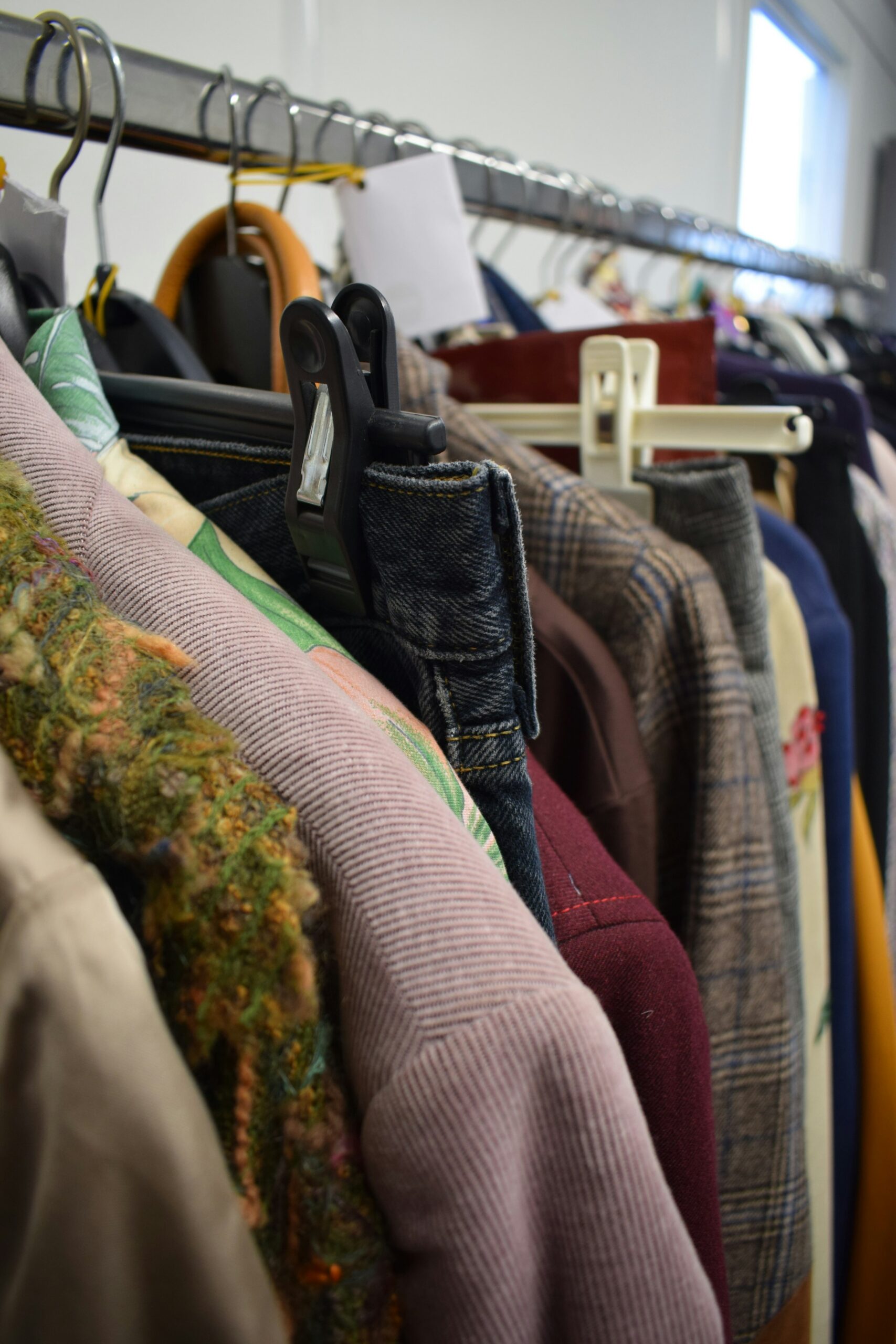A rail of clothes hanging up