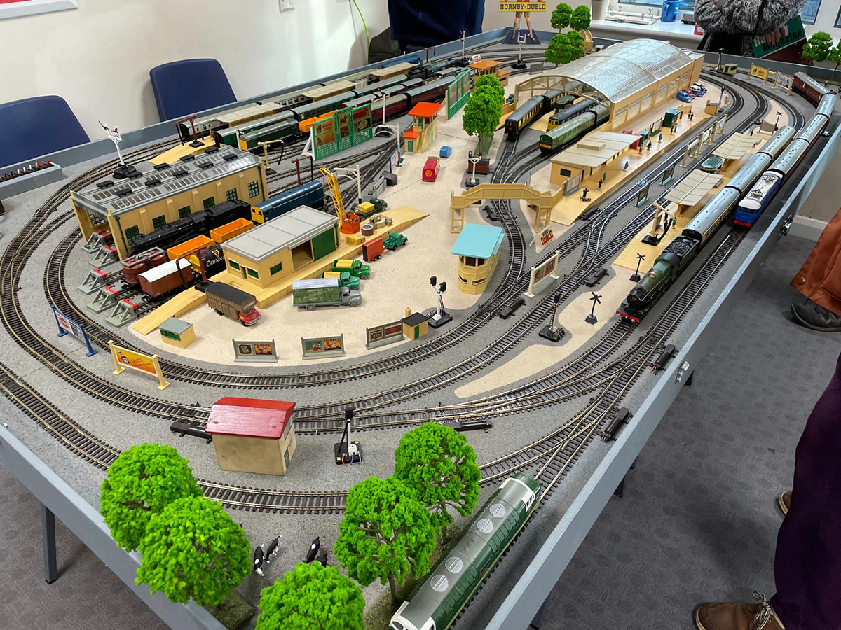 A top down view of a sizeable model railway on a table