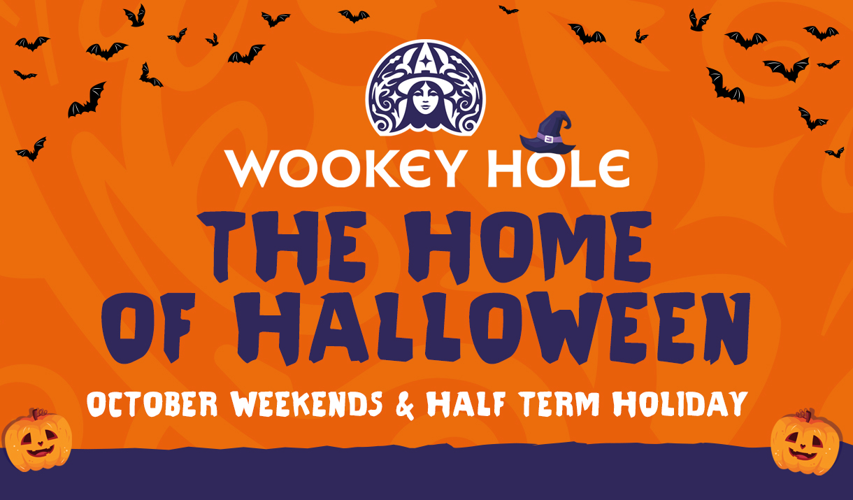 An orange background with illustrations of bats and pumpkins. The Text 'Wookey Hole The Home of Halloween' is in the centre